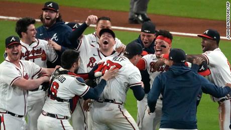 Atlanta Braves celebrate after winning Game 6 of baseball???s National League Championship Series against the Los Angeles Dodgers Saturday, Oct. 23, 2021, in Atlanta. The Braves defeated the Dodgers 4-2 to win the series. (AP Photo/John Bazemore)